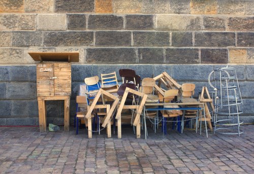 Professional garage clearance team organizing items in Penge garage