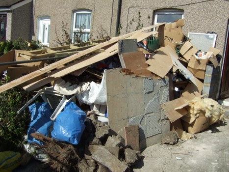 Image of inspector reviewing garden waste removal